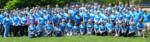 Large group of KAO employees at a volunteer event wearing bright blue shirts.