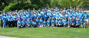 Large group of KAO employees at a volunteer event wearing bright blue shirts.