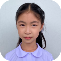 Portrait photo of Jinatta Banjongpisan, winner of the 2024 painting contest.