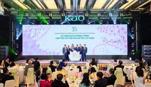 Kao event in Vietnam, with executives onstage before a large floral LED screen announcing a partnership program supporting Vietnamese women.