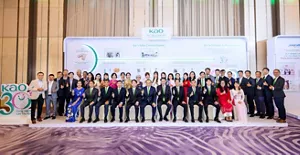 a large group of formally dressed attendees at a Kao corporate anniversary event