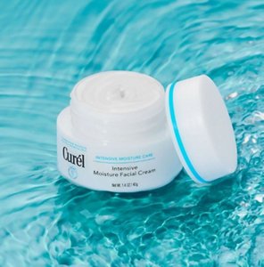 Curel rich facial moisturiser against a teal and water background