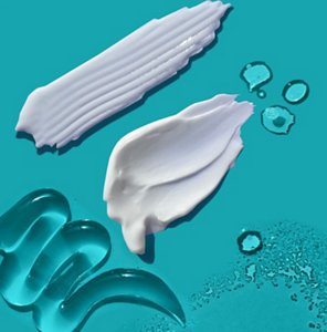 Swatches of Curél skincare products against a teal background