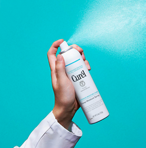 Curel Deep Moisture Spray against a blue background