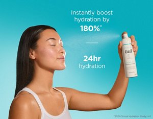 Young woman spraying the Curél Deep Moisture Spray onto her face