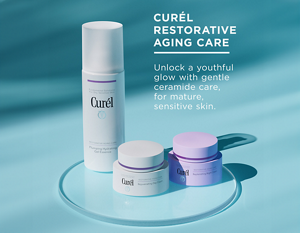 Curél Restorative Aging Care products on a round glass plate against a teal background