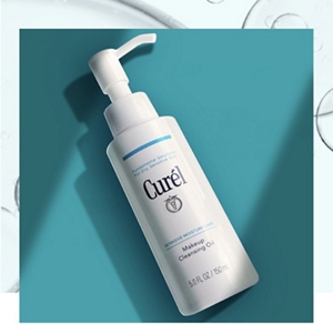 Curél Makeup Cleansing Oil against a dark teal background