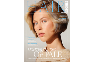four diverse woman with different hair colors and lenghts, which stand side by side and close to each other looking into the camera while standing in front of a clean grey background