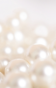 Pile of pearls on the white background