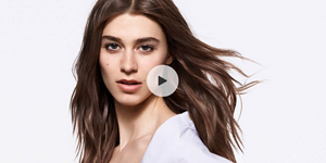 Woman with brown hair and bright background