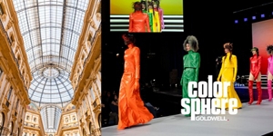 white woman with long blonde hair, which stands in front of a clean grey background looking into the camera