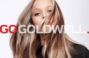 Woman with blonde hair in front of bright background and Go Goldwell logo in front