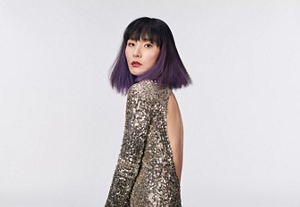 a red hair woman with beautiful long hair who used goldwell hair products