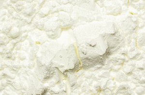 Clumpy, yellowish powder