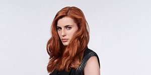 red hair woman goldwell hair products