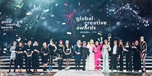 winners on stage of global creative awards 2023