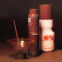A group shot of the early Goldwell Depot Can System, wth a mixing bowl, brush, hair dye and dye developer created for convenient and accurate color mixing