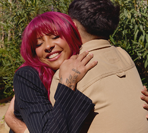 Two young people embrace, demonstrating Goldwell's core value of Empathy