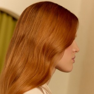 Model posing for Blond made better Product by Goldwell