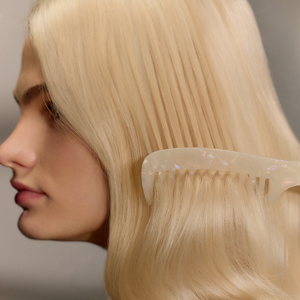 Model posing for Blond made better Product by Goldwell