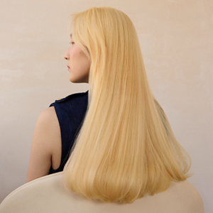 Model posing for Blond made better Product by Goldwell