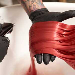 A collage of images showing the Goldwell Color of the Year 2026, Bellini, on real hair, when dry, during the dyeing and when wet.