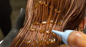 Model posing for Glow To Go Product by Goldwell