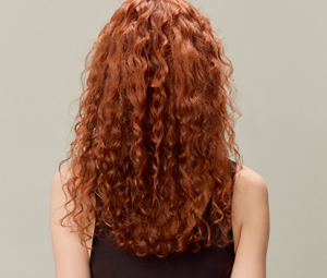 Model posing for Glow To Go Product by Goldwell