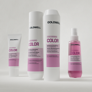 Goldwell Dualsenses Color products shown as shampoo, conditioner, treatment and serum packaging arranged together on a light grey studio background.