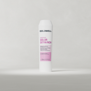 Goldwell Dualsenses Color Extra Rich Conditioner 200 ml tube standing upright on a soft light grey studio background.