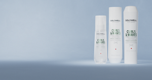Group shot of Goldwell's Dualsenses Curls & Waves range with Milk Protein to cleanse and hydrate naturally wavy, curly and permed hair. Including Hydrating Shampoo, Hydrating Conditioner and Hydrating Serum Spray