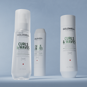 Group shot of Goldwell's Dualsenses Curls & Waves range with Milk Protein to cleanse and hydrate naturally wavy, curly and permed hair. Including Hydrating Shampoo, Hydrating Conditioned and Hydrating Serum Spray