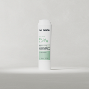 Goldwell Dualsenses Curls & Waves Bundling Conditioner 200 ml tube standing upright on a soft light grey studio background.