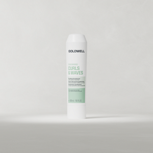 Goldwell Dualsenses Curls & Waves Bundling Conditioner 300 ml tube standing upright on a soft light grey studio background.