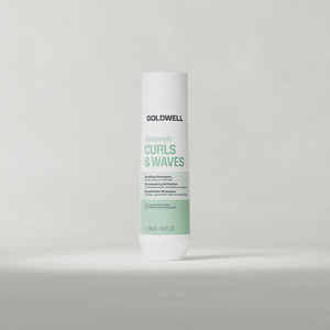 Goldwell Dualsenses Curls & Waves Bundling Shampoo 250 ml bottle standing upright on a soft light grey studio background.