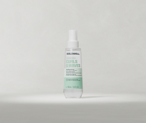 Goldwell Dualsenses Curls & Waves Bundling Spray bottle standing upright on a soft light grey studio background.