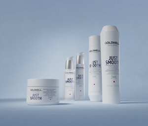 Group shot of Goldwell's Dualsenses Just Smooth range with Kukui Nut Oil to control and manage unruly and frizzy hair. Including Taming Shampoo, Taming Conditioner, Taming Oil, 6 Effects Serum and 60 Sec Treatment