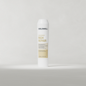 Goldwell Dualsenses Rich Repair Conditioner 300 ml tube standing upright on a soft light grey studio background.