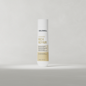 Goldwell Dualsenses Rich Repair Shampoo 250 ml bottle standing upright on a soft light grey studio background.