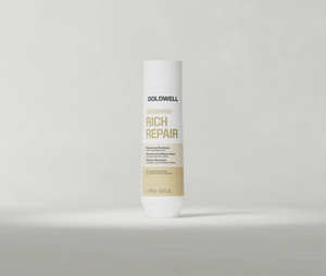 Goldwell Dualsenses Rich Repair Shampoo 250 ml bottle standing upright on a soft light grey studio background.