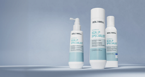 Goldwell Dualsenses Scalp Specialist haircare range displayed as three white and aqua products on a soft blue studio background.