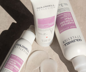 A group shot of Goldwell's StyleSign Heat Styling products, including the Everyday Blow-Dry Spray, Smoothing Serum Spray and Straightening Balm