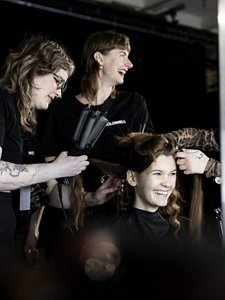 Models posing for Glow Up News Product by Goldwell  