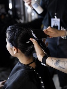 Model posing for Glow Up News Product by Goldwell  
