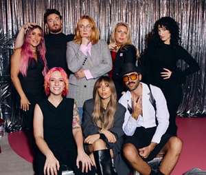 A group photo of 8 hair stylists from the Goldwell Color Collective movement