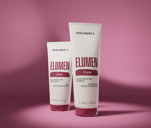 Goldwell Elumen Care rangeshot bottles arranged on a burgundy pink studio background.