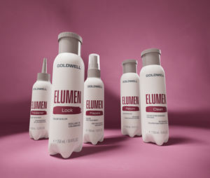Goldwell Elumen Support rangeshot bottles arranged on a burgundy pink studio background.