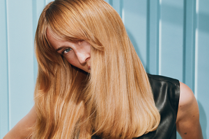 Goldwell Elumen trends carousel image featuring a model with long blonde hair in an editorial setting