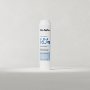 Goldwell Dualsenses Ultra Volume Conditioner 200 ml tube standing upright on a soft light grey studio background.