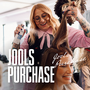 A stylist Jools Purchase talks to a customer